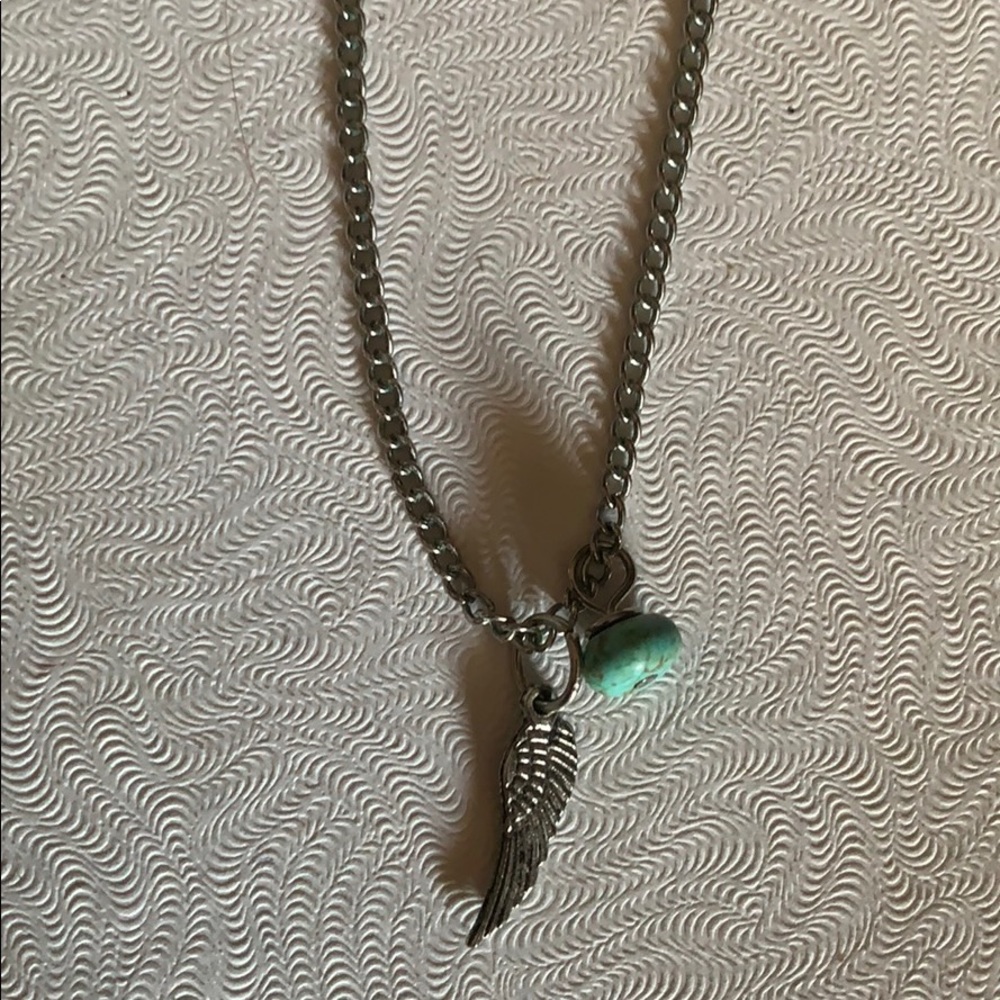 Alive feather and turquoise ball necklace.